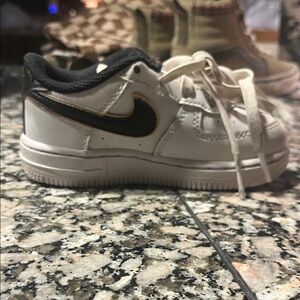 Nike Kids White and Black Sneakers with Gold Accent
